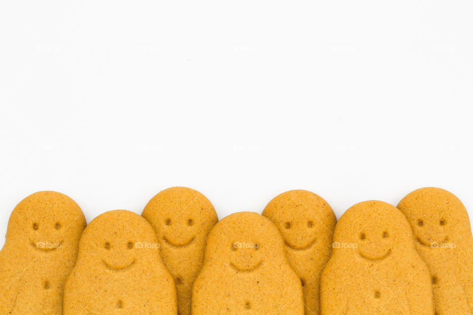 Smiling gingerbread men in a row.