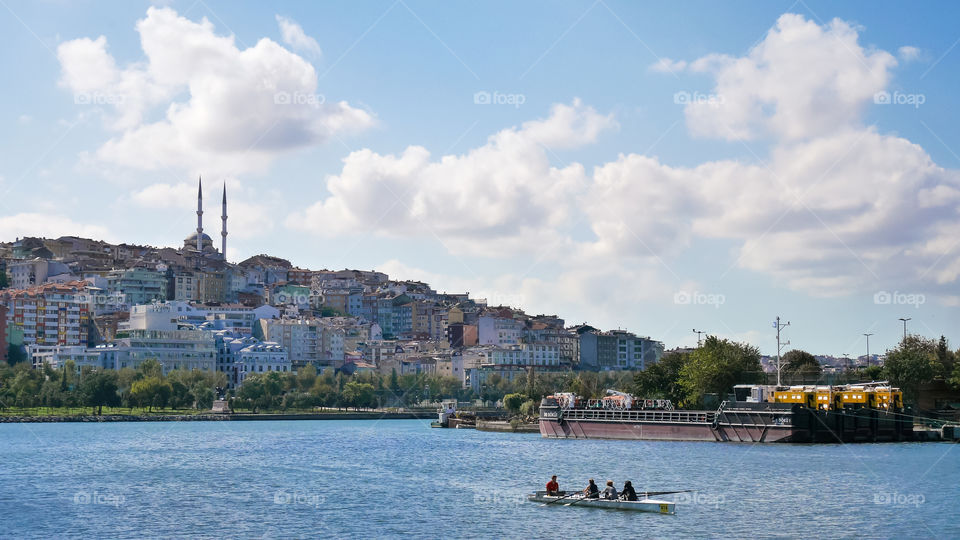 rowing boat in the middle of a big river