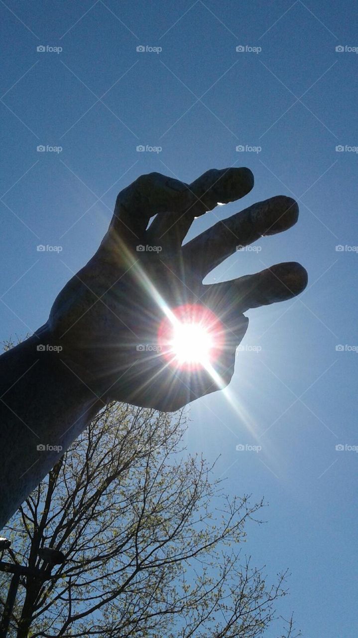 sunlight through art sculpture