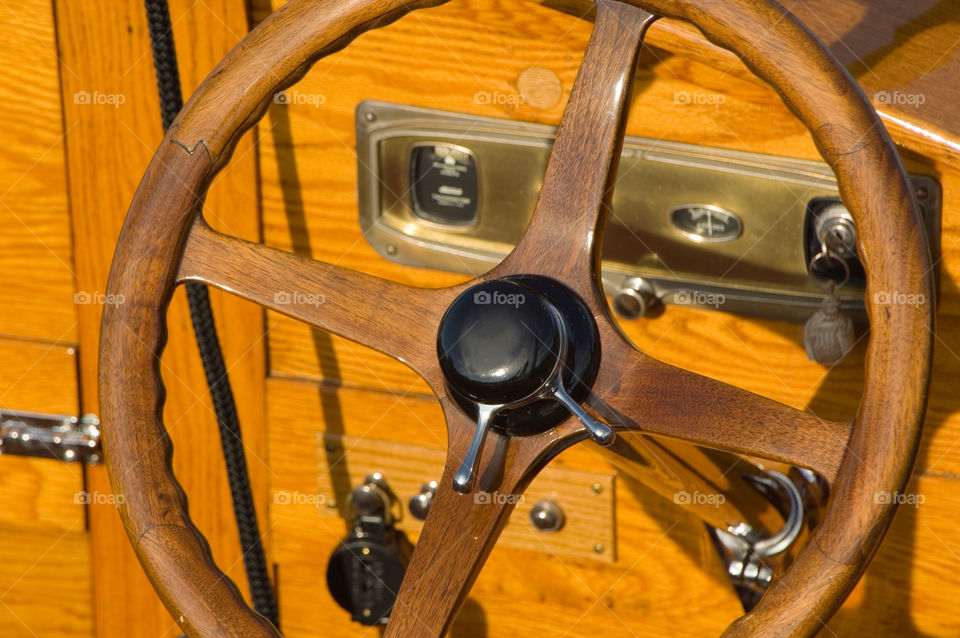 Steering wheel of an antique wooden boat