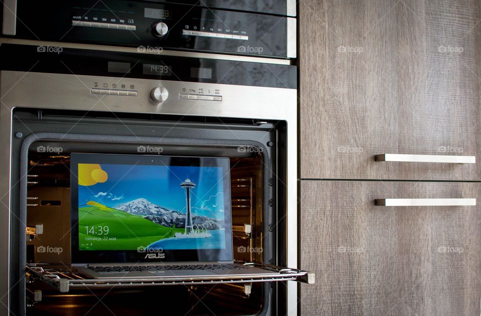 a kitchen desk. an oven as a desk