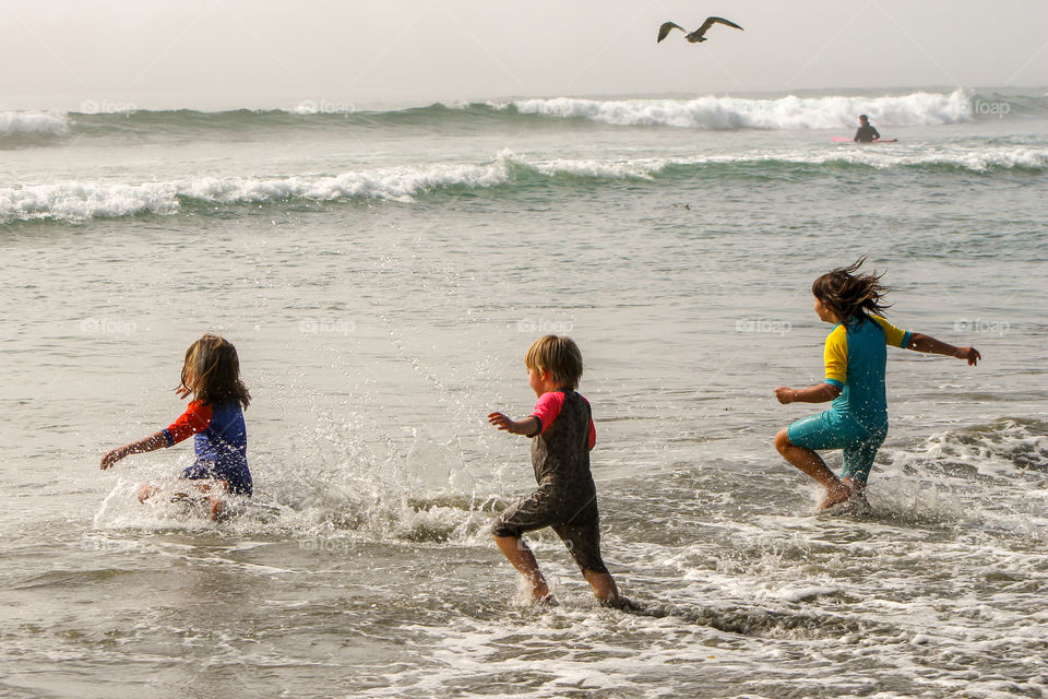 My fav moments are primarily times with my family. Some of my favourite moments involve catching photos of them playing.  We spend a great deal of time at the beach & in the water & this photo was when we just arrived. Getting wet is first! 