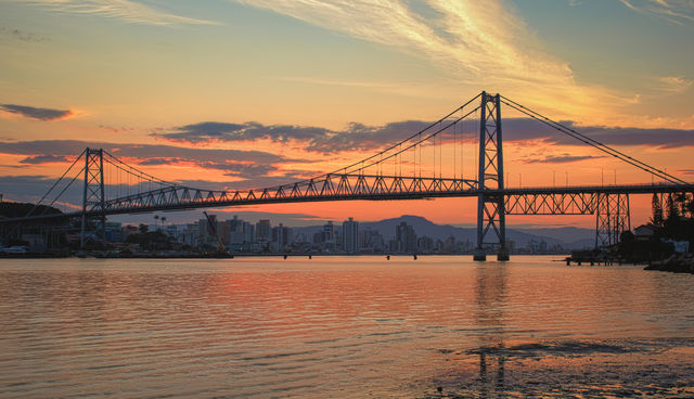Hercílio Luz Bridge in Florianópolis - Santa Catarina - Brazil, with sunset in the background.