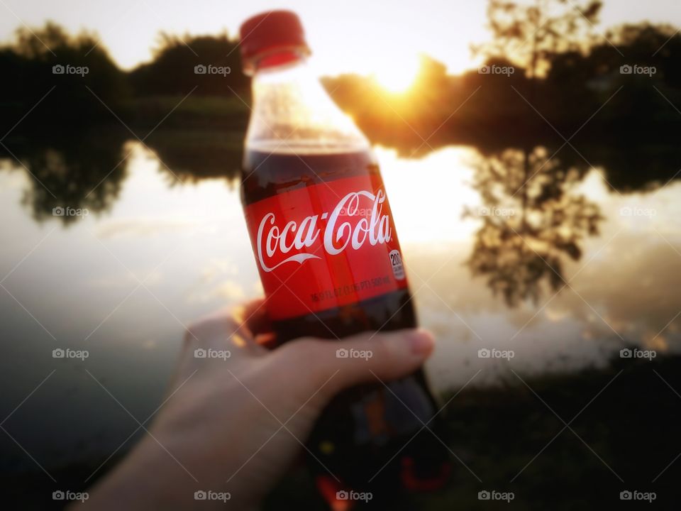 Holding a Coke