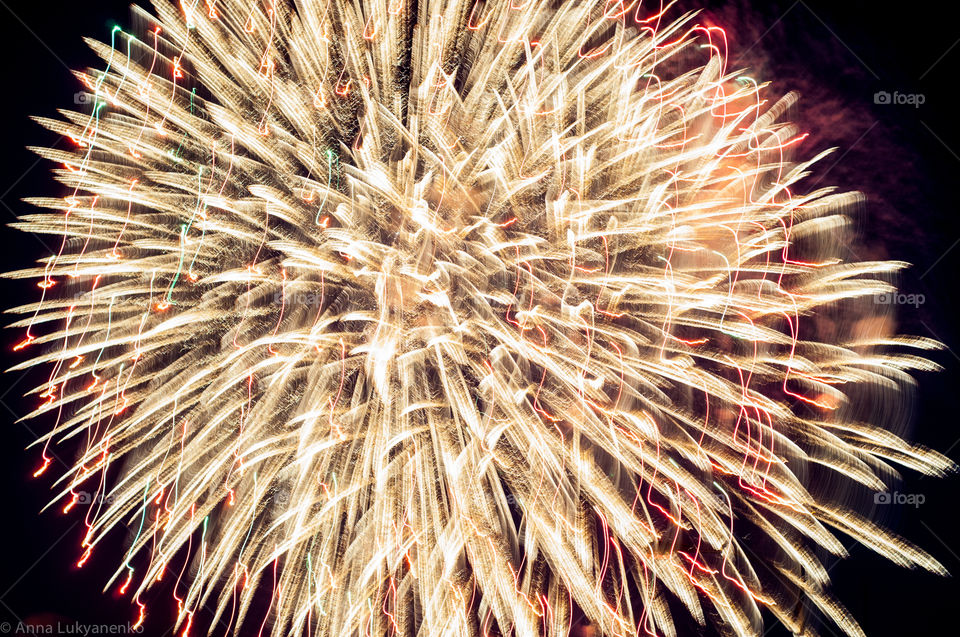 Lights of fireworks on dark sky 