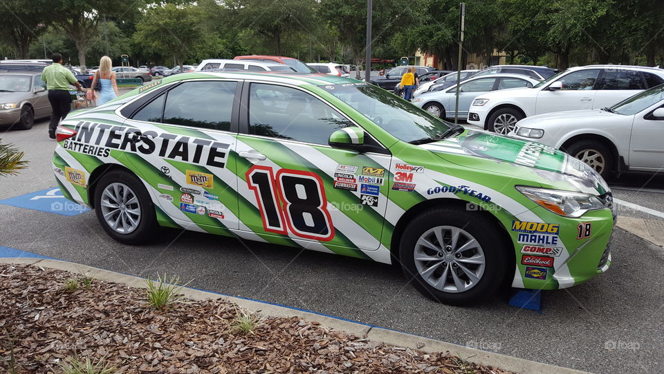 Camry carwrapped with Kyle Busch's Interstate Batteries #18 pain scheme.