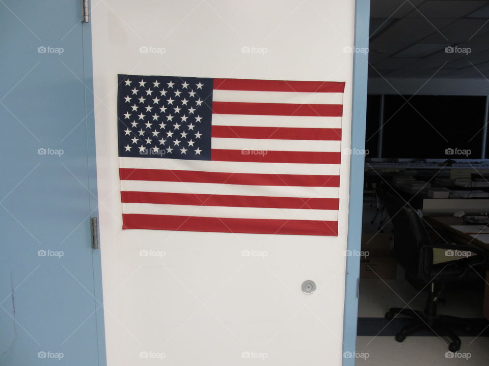 School Class Room with Flag. The flag of the United States hung in a school classroom