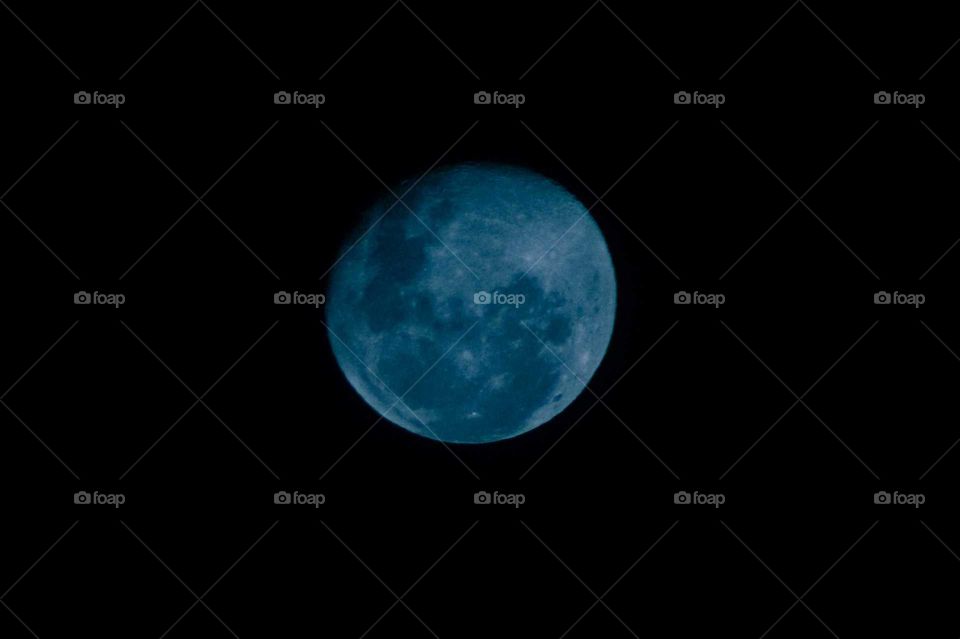 Blue Moon in the dark sky