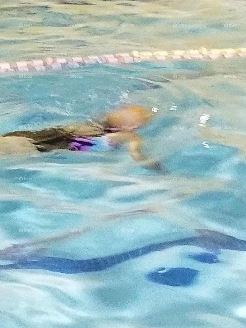 Girl swimming in pool