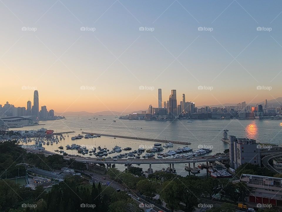 Rooftop view of sunset at Hong Kong Victoria Harbour