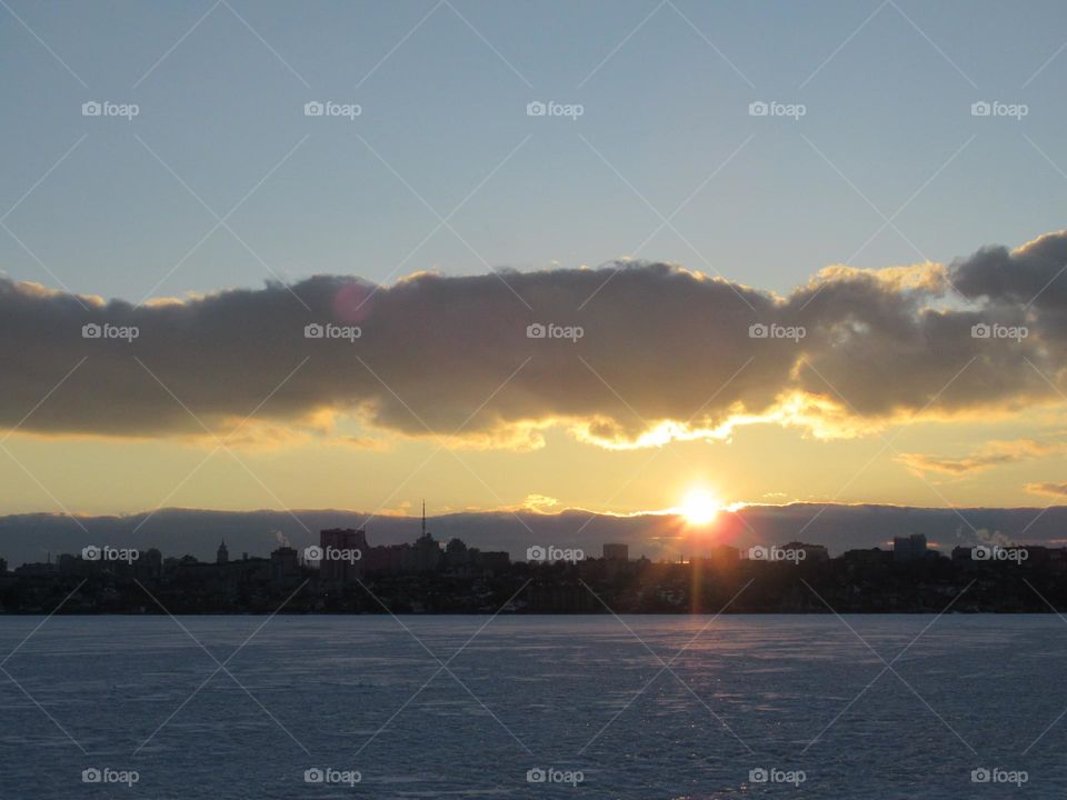 evening, sunset, March, ice on the river, sky and clouds