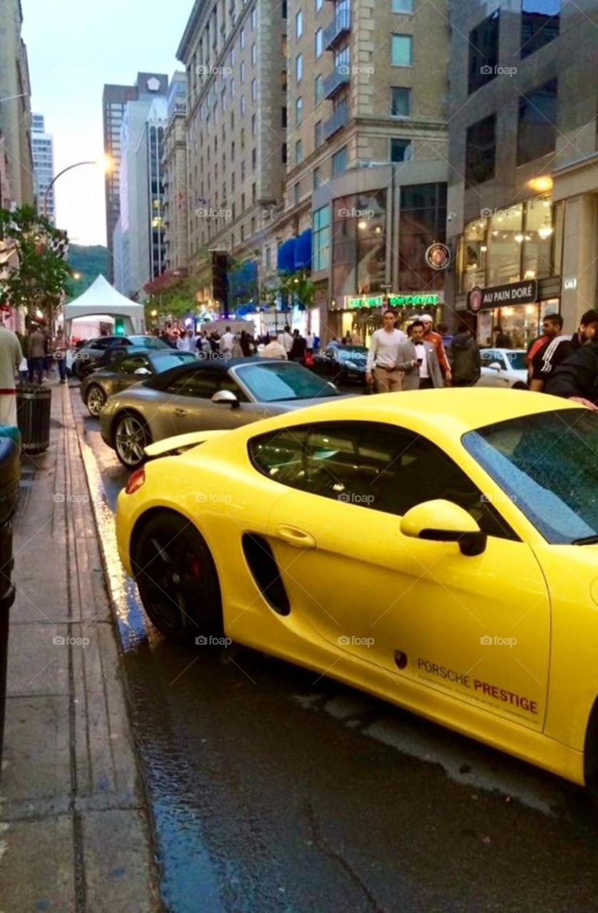 yellow Porsche  in downtown Montreal 