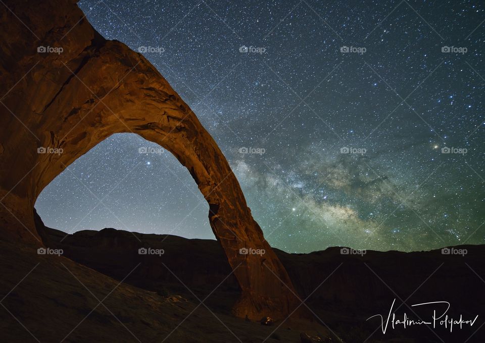 Milky Way rising over corona arch Moab Utah