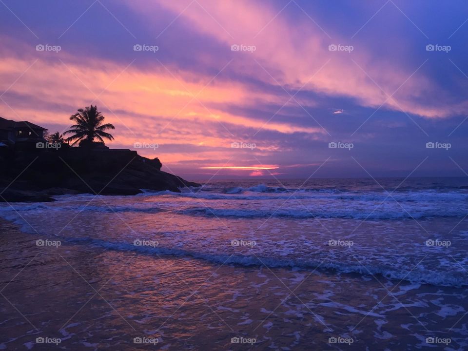 Pink and purple sunset on the tropical beach 