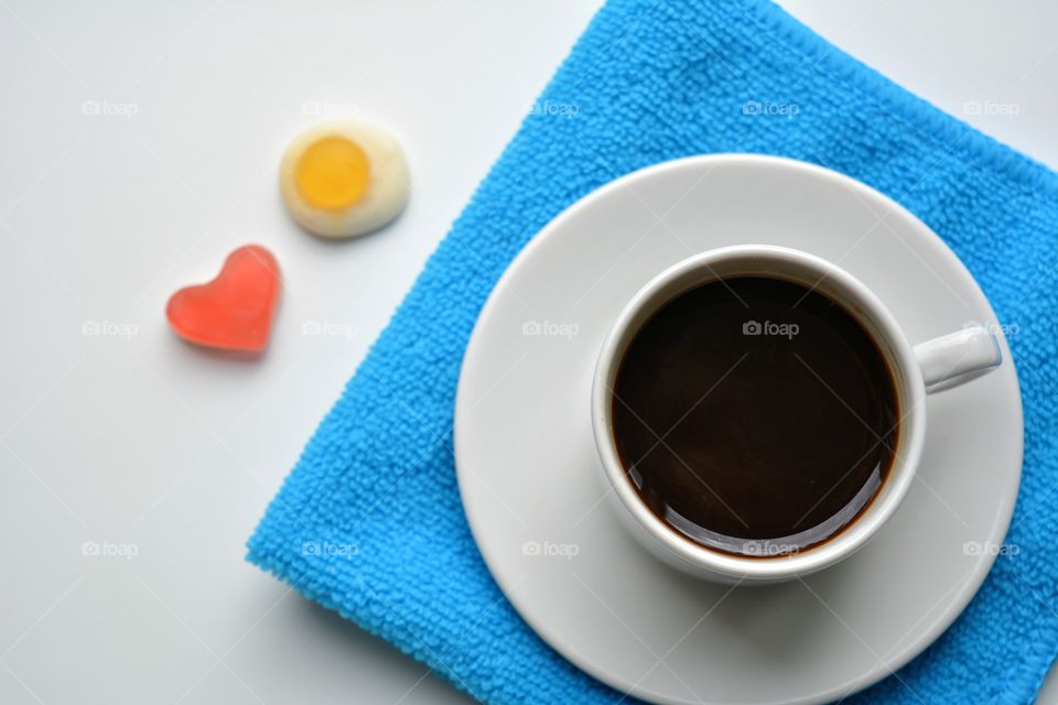 coffee mug and sweet on a white background top view