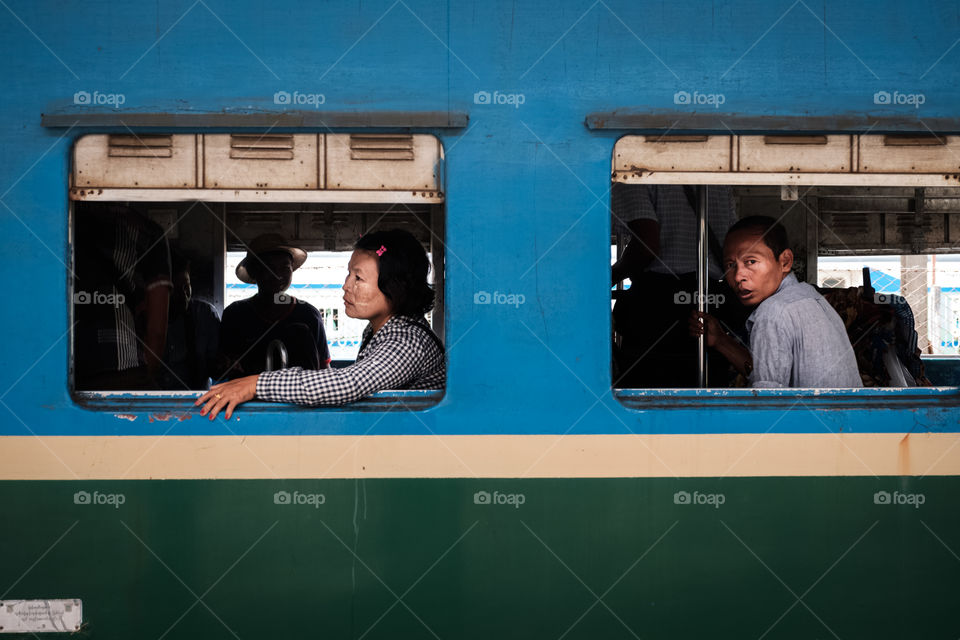 Myanmar burmese passenger are looking out train window in Yangon Central Railway Station, the Largest Railway Station in Myanmar