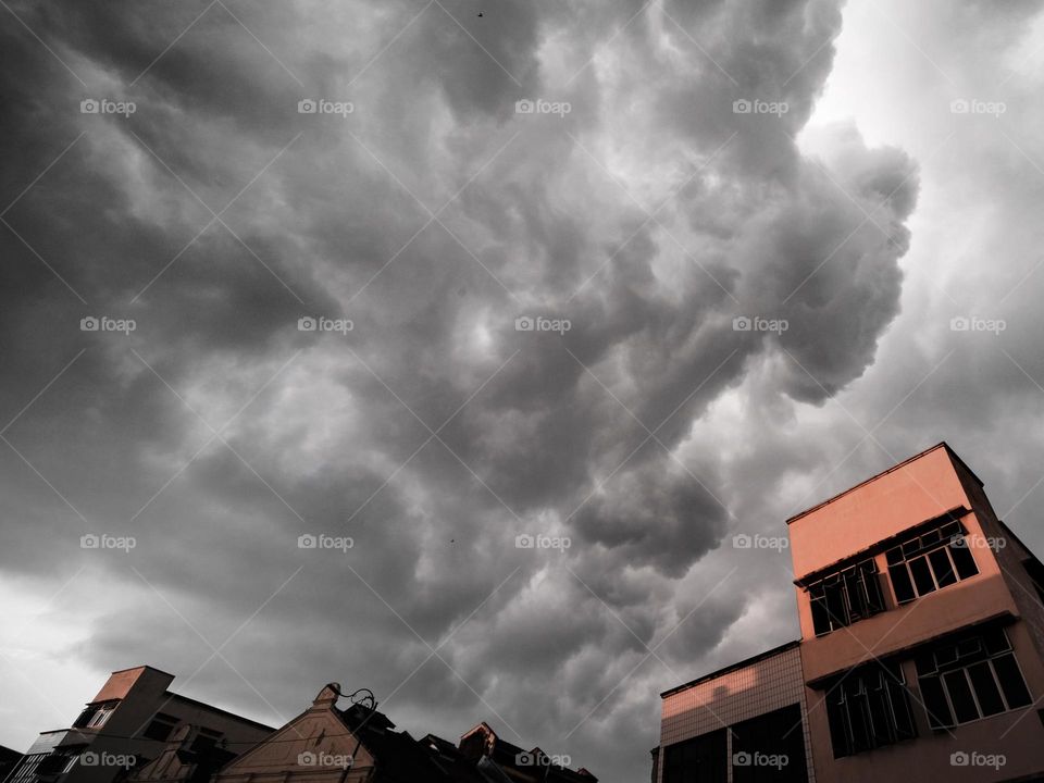 Dark monsoon clouds above a building in Teluk Intan, Malaysia