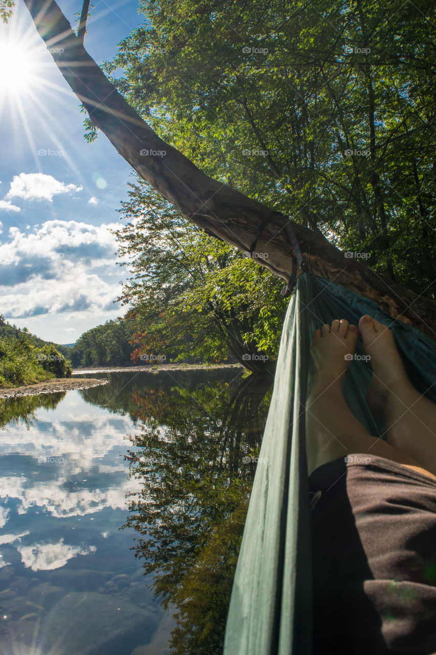 Hammocking over a calm river