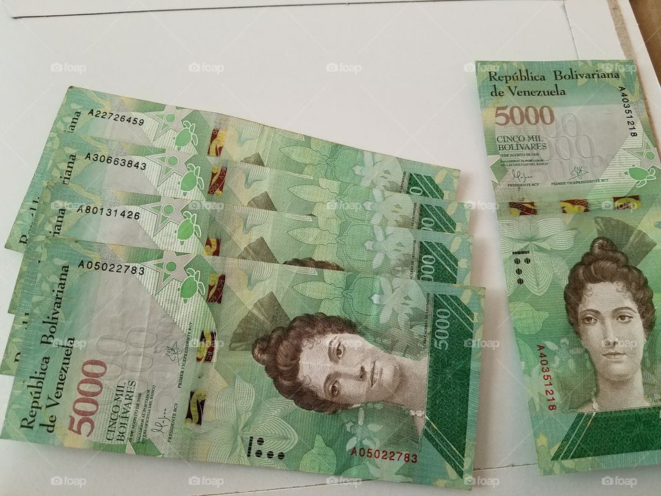 bright green bills of almost valueless currency