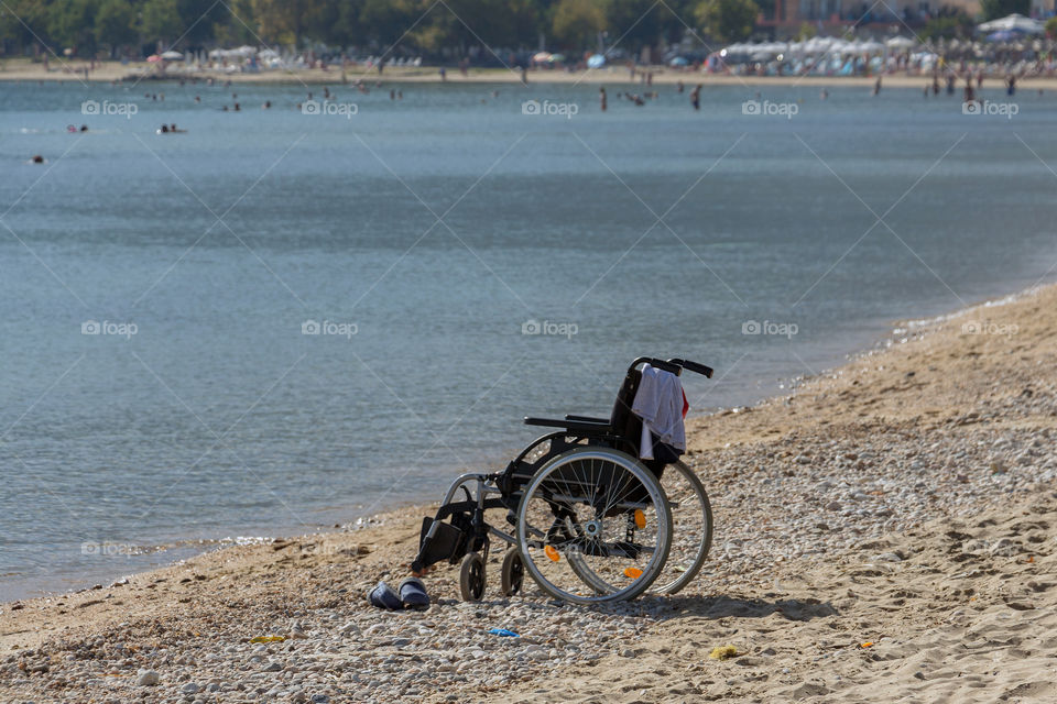 A wheelchair at a public beach in Greece