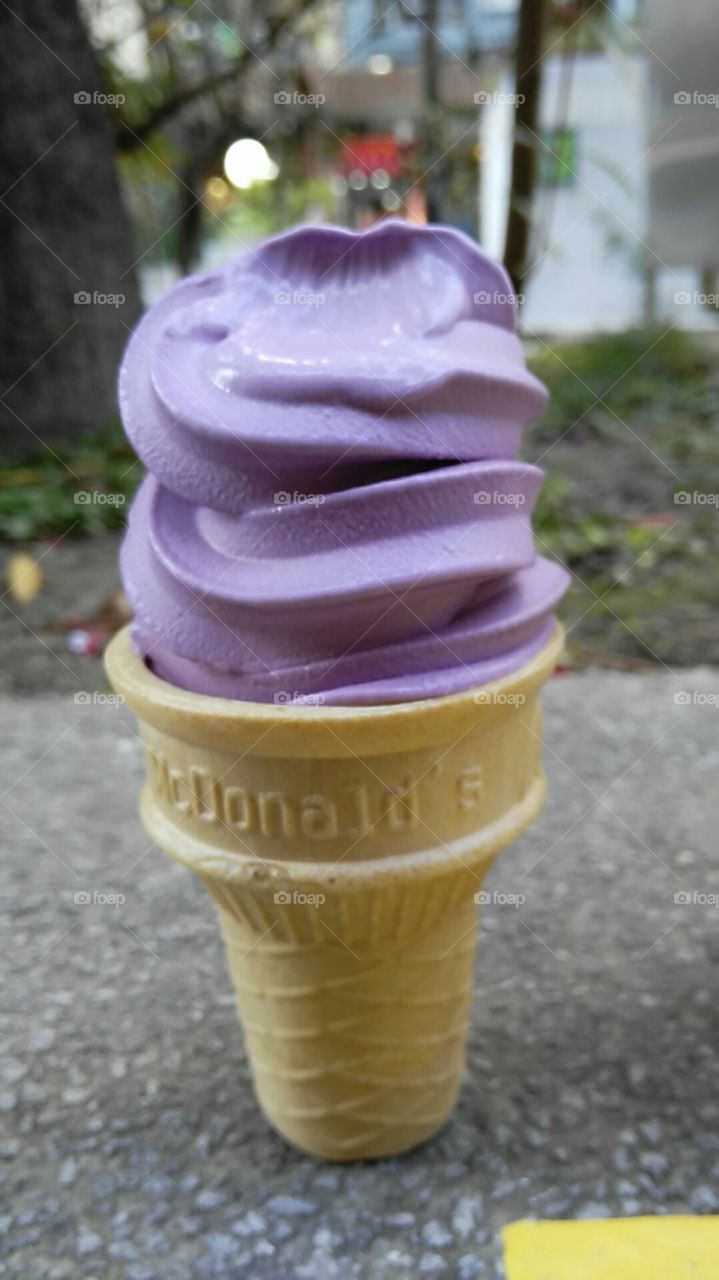 beat the heat with purple icecream in a cone