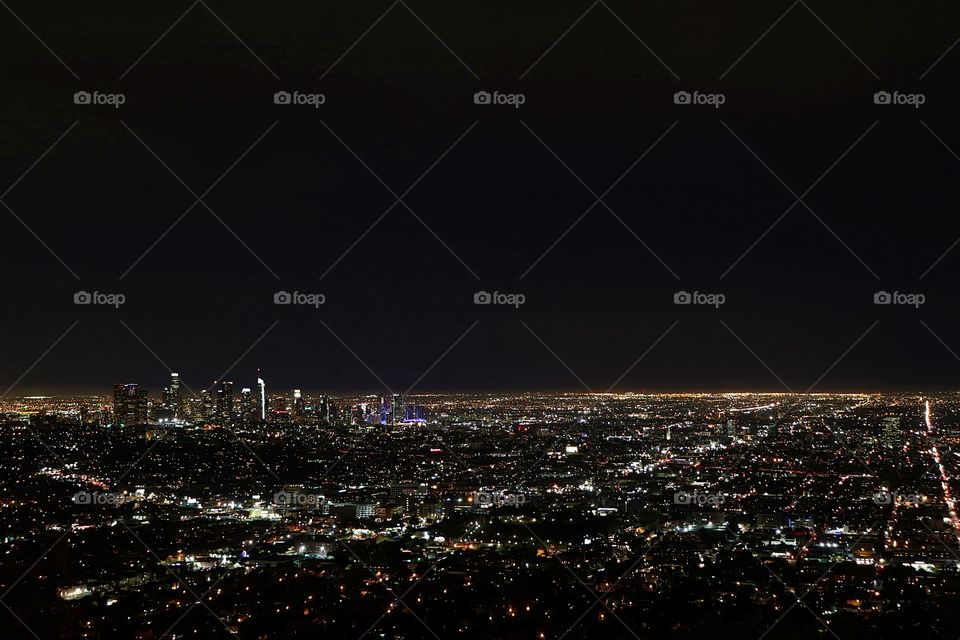 enjoying the view of Los Angeles skyline from Griffen Observatory at night