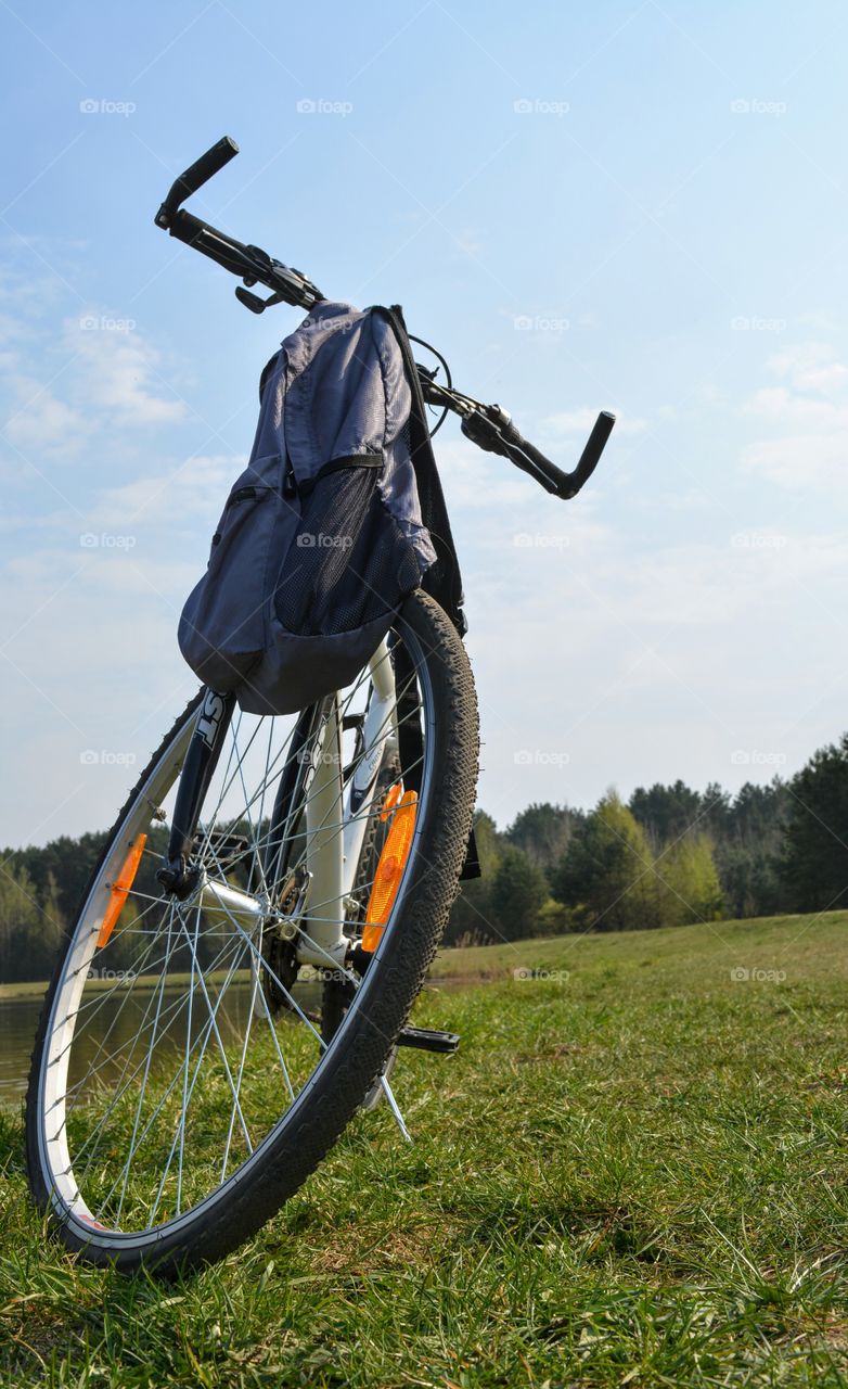 bike on a lake shore beautiful spring landscape blue sky background