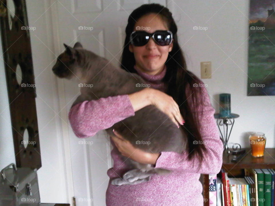 My daughter Raquel holding her precious Cat Momo!