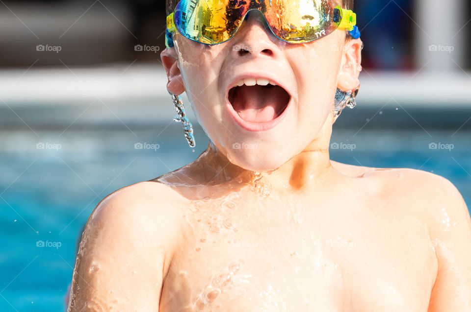 Fun in the Pool swimming with his goggles