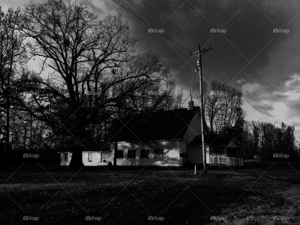 A B&W photo of a small rural church in the south