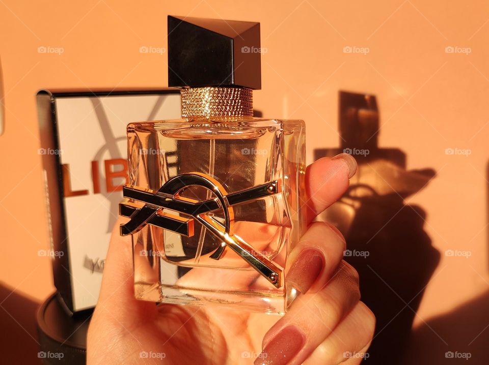 Perfume bottle in a hand/ YvesSaintLaurent Libre eau de parfum photo/ daylight, product photography /Beauty products