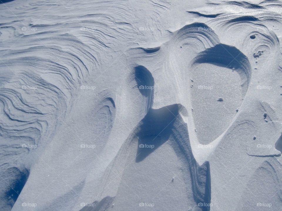 Wind sculpting the snow. 