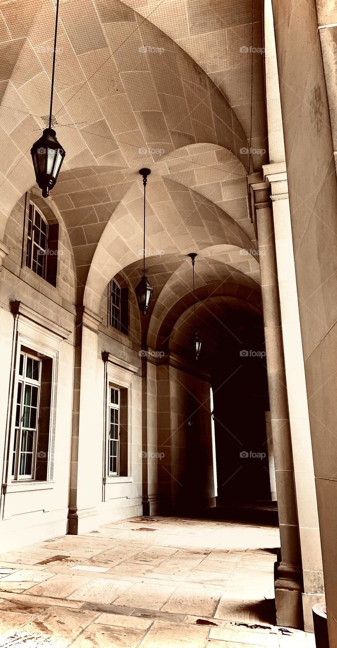 Outside architecture of Federal Triangle Station in Washington,DC of sunlight pouring through arches