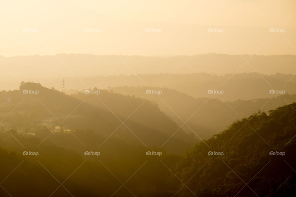 Scenic view of foggy mountains