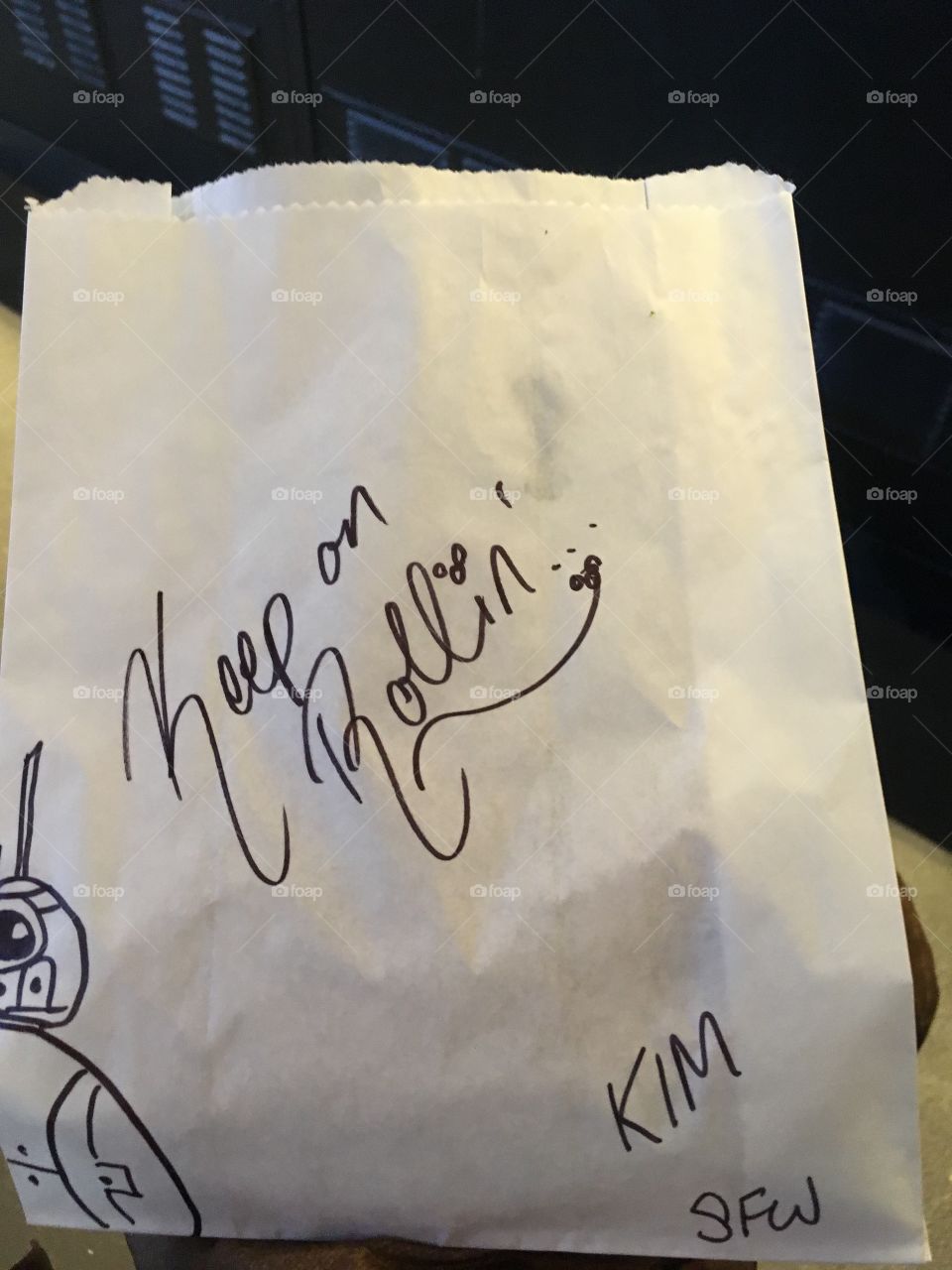 A handwritten note and sketch of r2d2 on a Starbucks order 