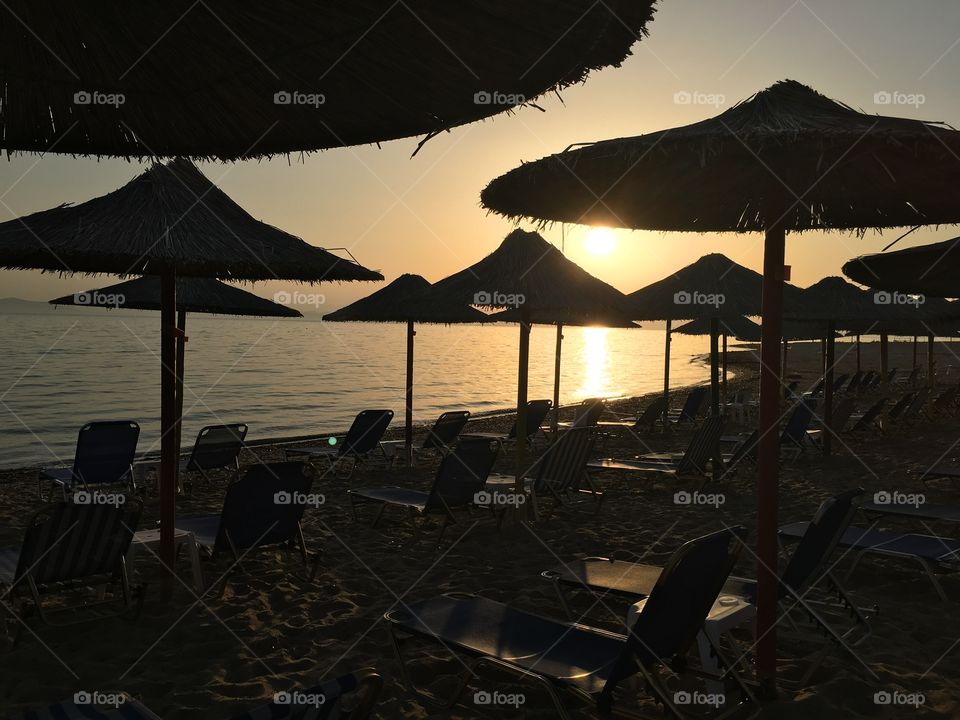 Parasols and lounge chairs at beach