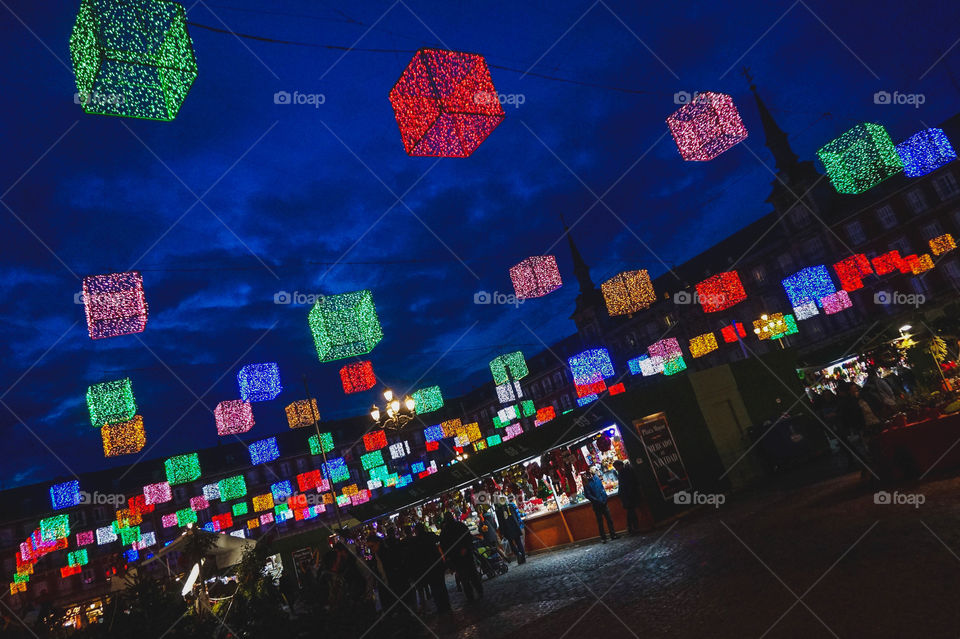 Giant festive Christmas lights hanging over Plaza Mayor in Madrid, Spain. Such a spectacular sight!