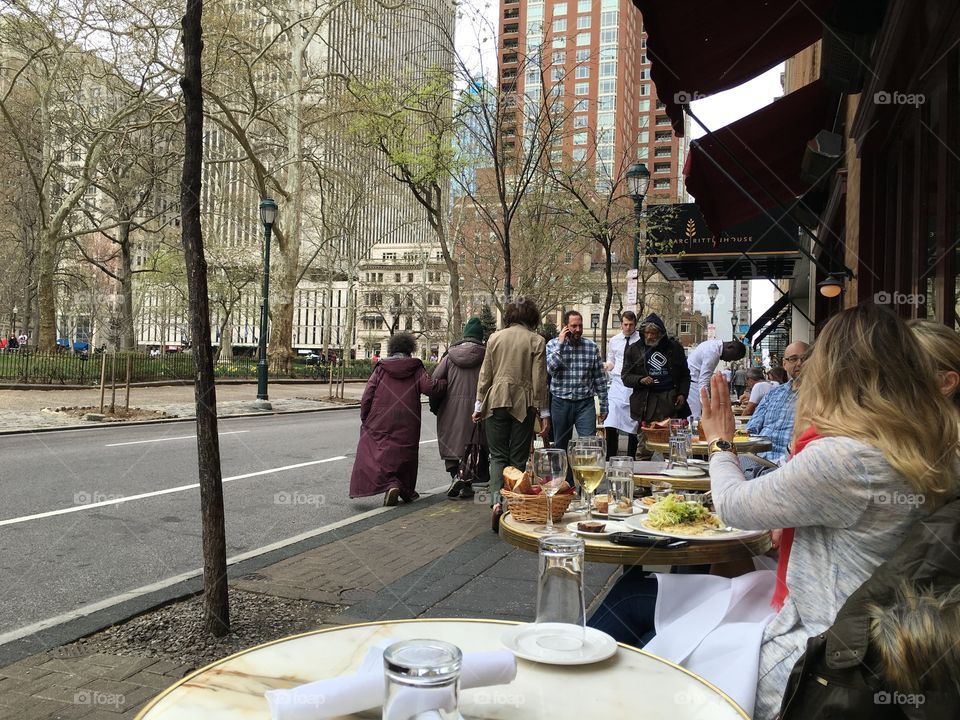 Enjoying the food and watching people passing by