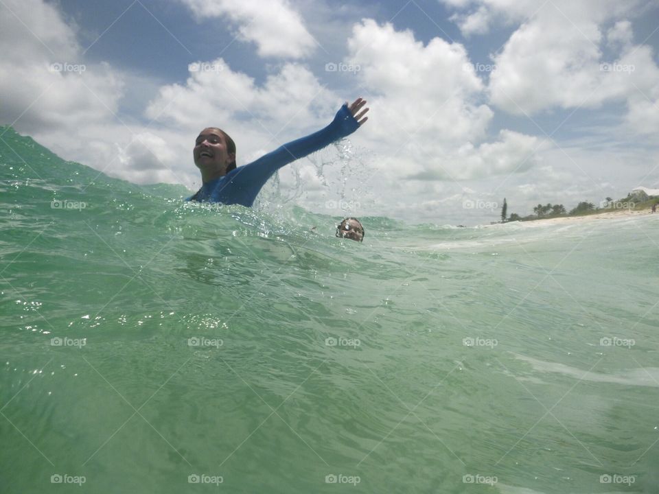 Girl splashing in waves