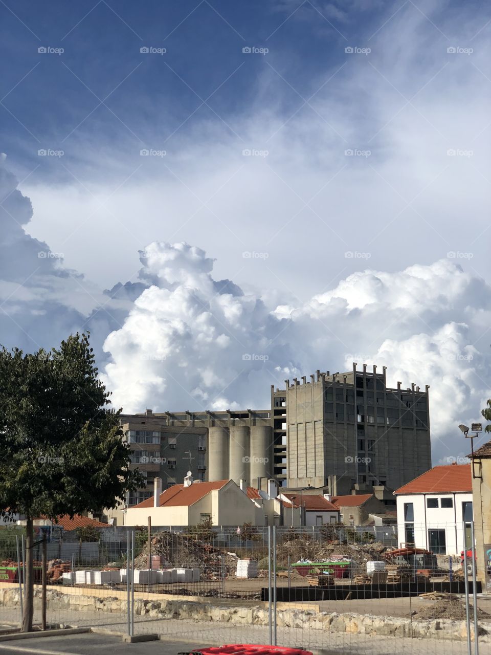 City and sky full of clouds