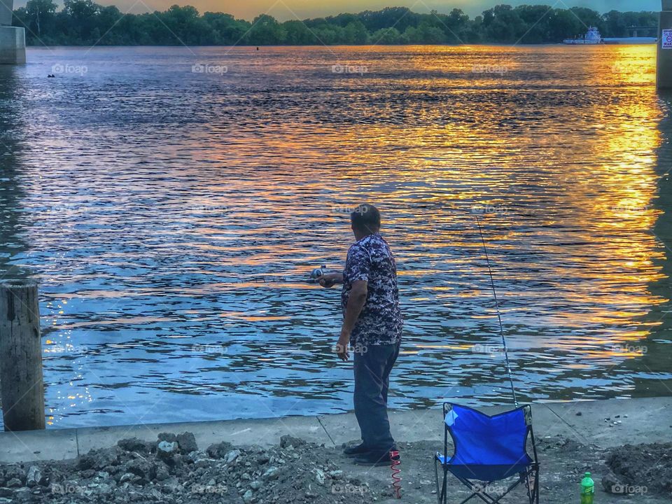 Fishing at sunset. 