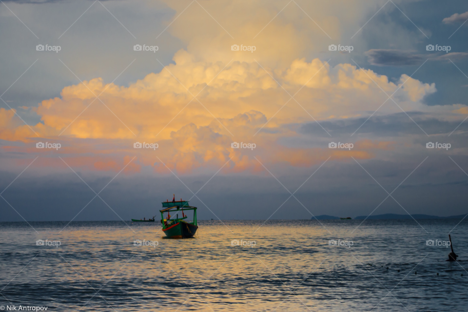 sky clouds sea boat by NikAntropov