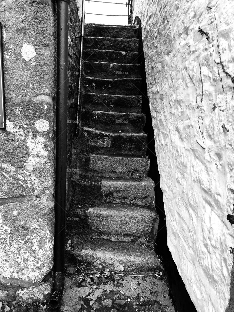 A seat of steps alongside the entrance of St Michaels Church, Ilsington, Dartmoor, Devon, (black and white)