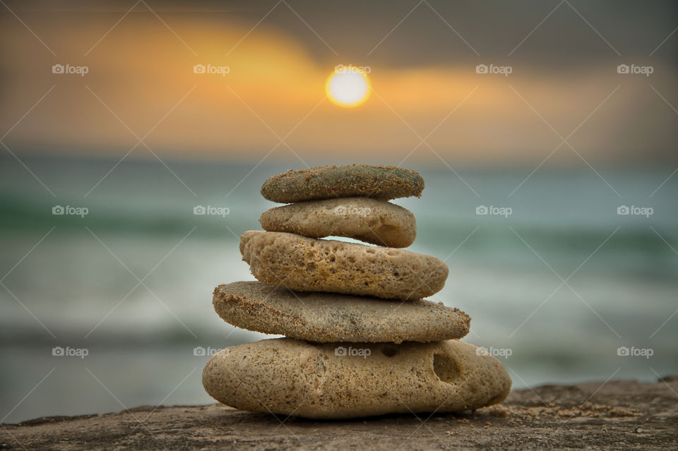 Closeup of a stack of stones on rock