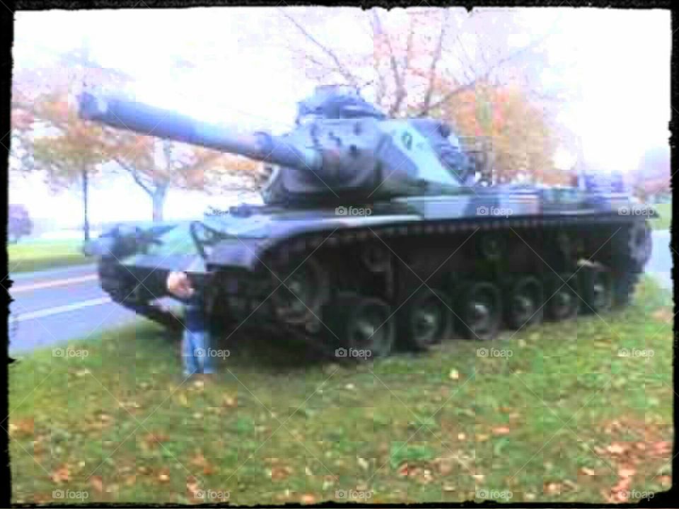 Army Tank. my son standing on front of an Army tank