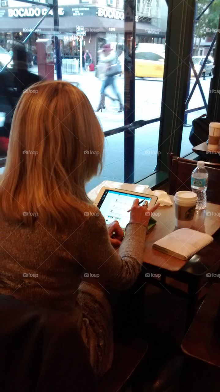 Working in Starbucks. NYC indoors coffee shop