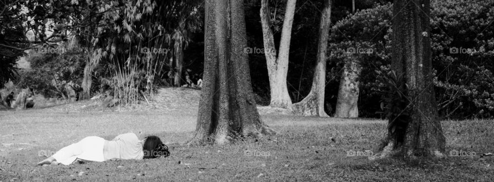 Girl sleeping in park. Singapore, Chinese Gardens. 11 October 2015