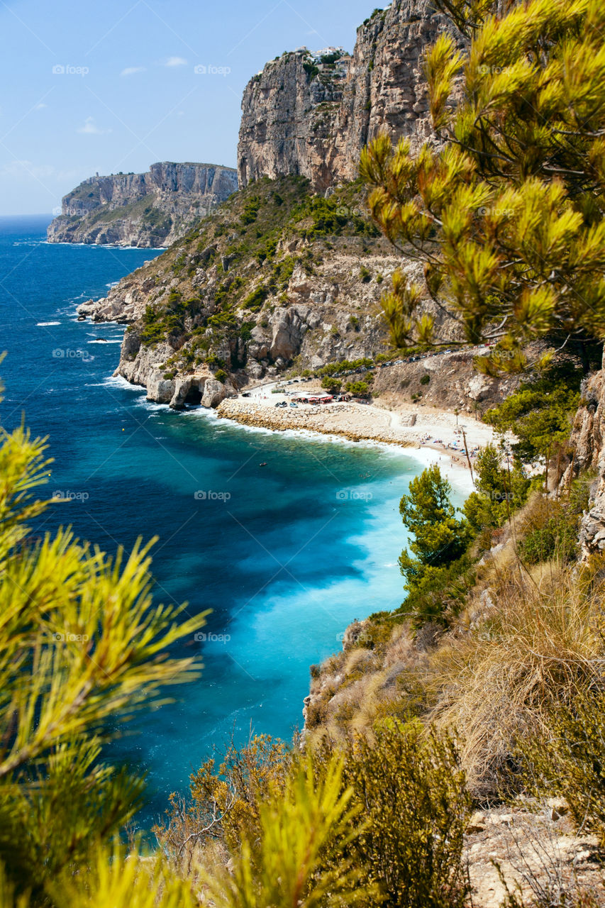 Beautiful seaside. View of the beach, mountains, rocks. Costa Blanca Spain.