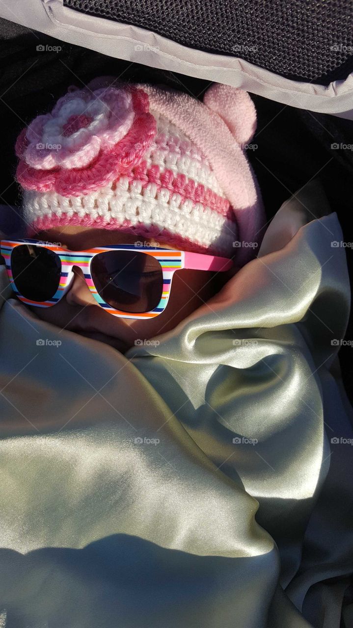 snuggled deep in blankets out for a walk. perfect for a nap. cozy and warm yet so cool in my shades