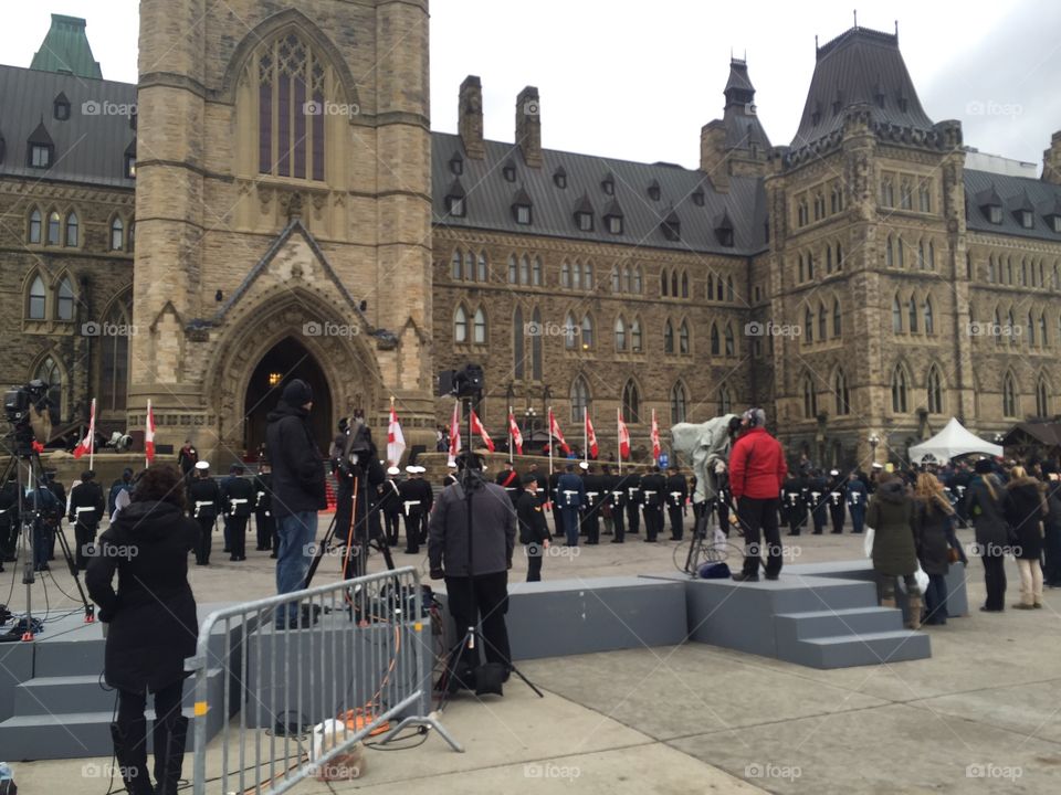 Military members line up in formation outside of Canada's parliament building before the Throne Speech in 2015.